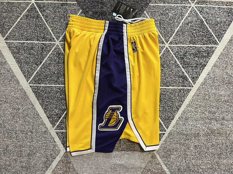 Yellow LA Lakers basketball shorts, side panel detail