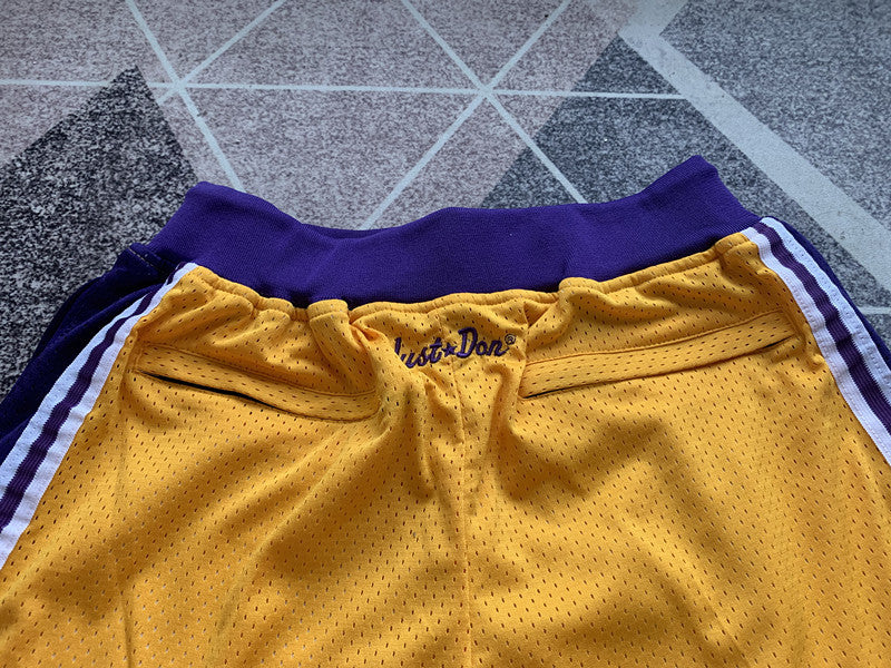 Yellow LA Lakers premium basketball shorts, waistband and label detail