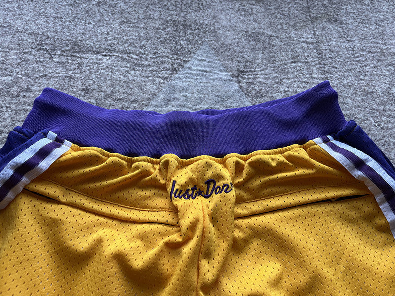 Yellow LA Lakers premium basketball shorts, waistband and label detail
