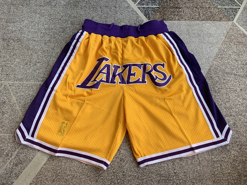 Yellow LA Lakers premium basketball shorts, full front view