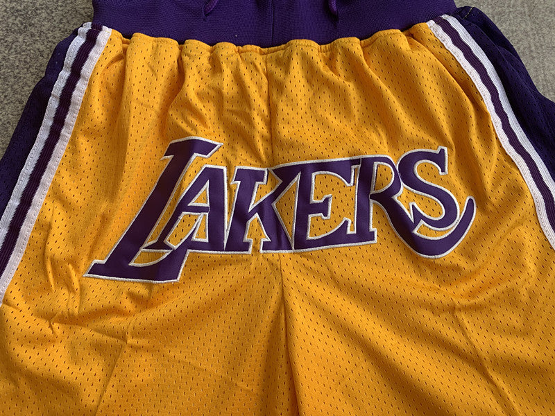 Yellow LA Lakers premium basketball shorts, graphic detail