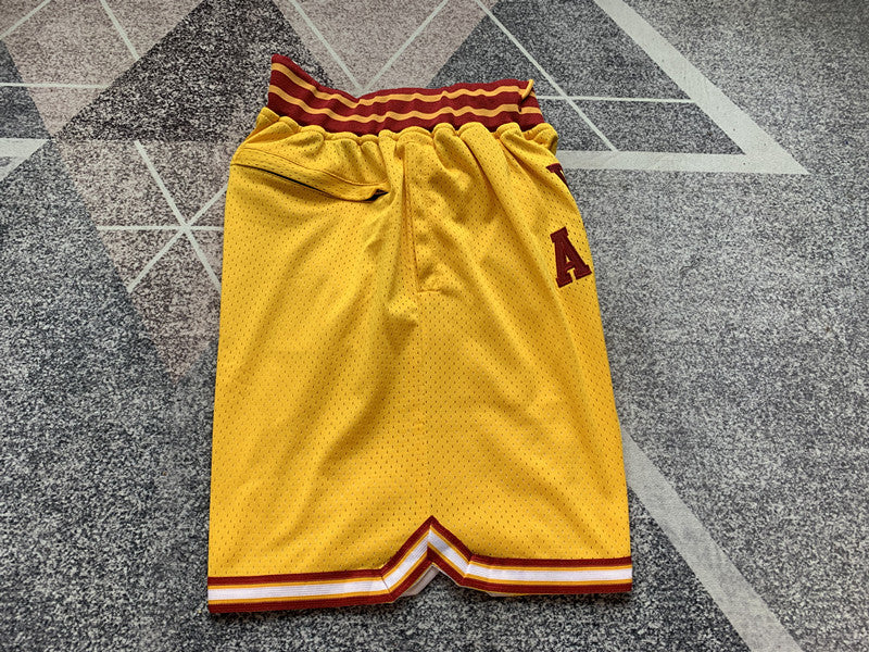 Yellow Lower Merion premium basketball shorts, side panel detail