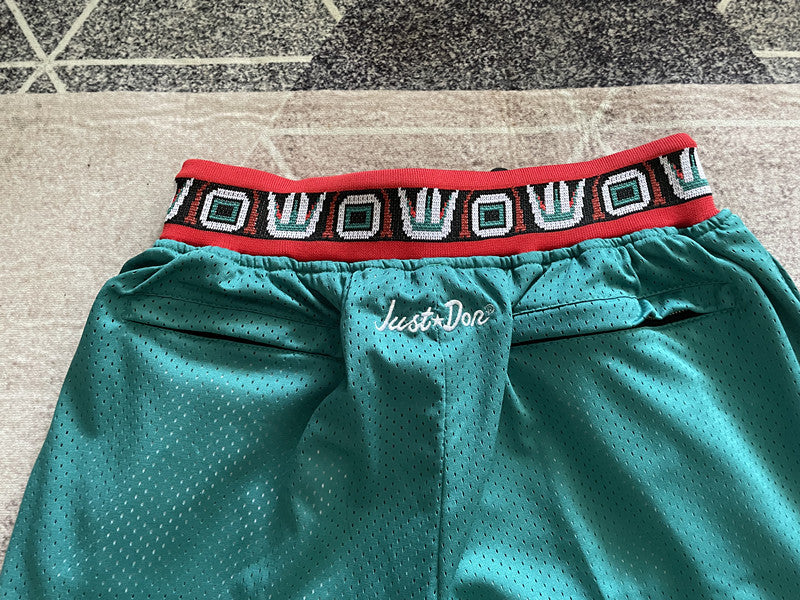 Green Memphis Grizzlies premium basketball shorts, waistband and label detail