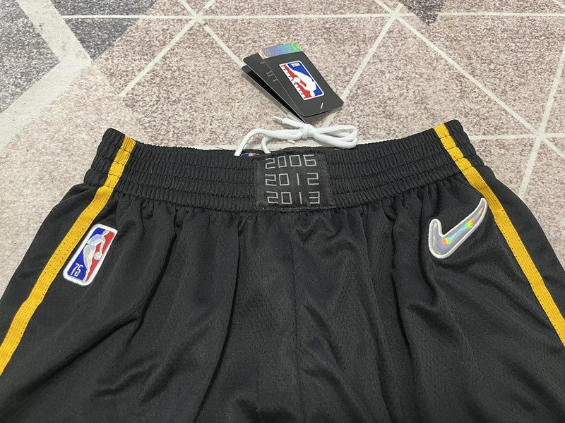 Black Miami Heat basketball shorts, waistband and logo detail