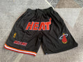 Black Miami Heat premium basketball shorts, full front view