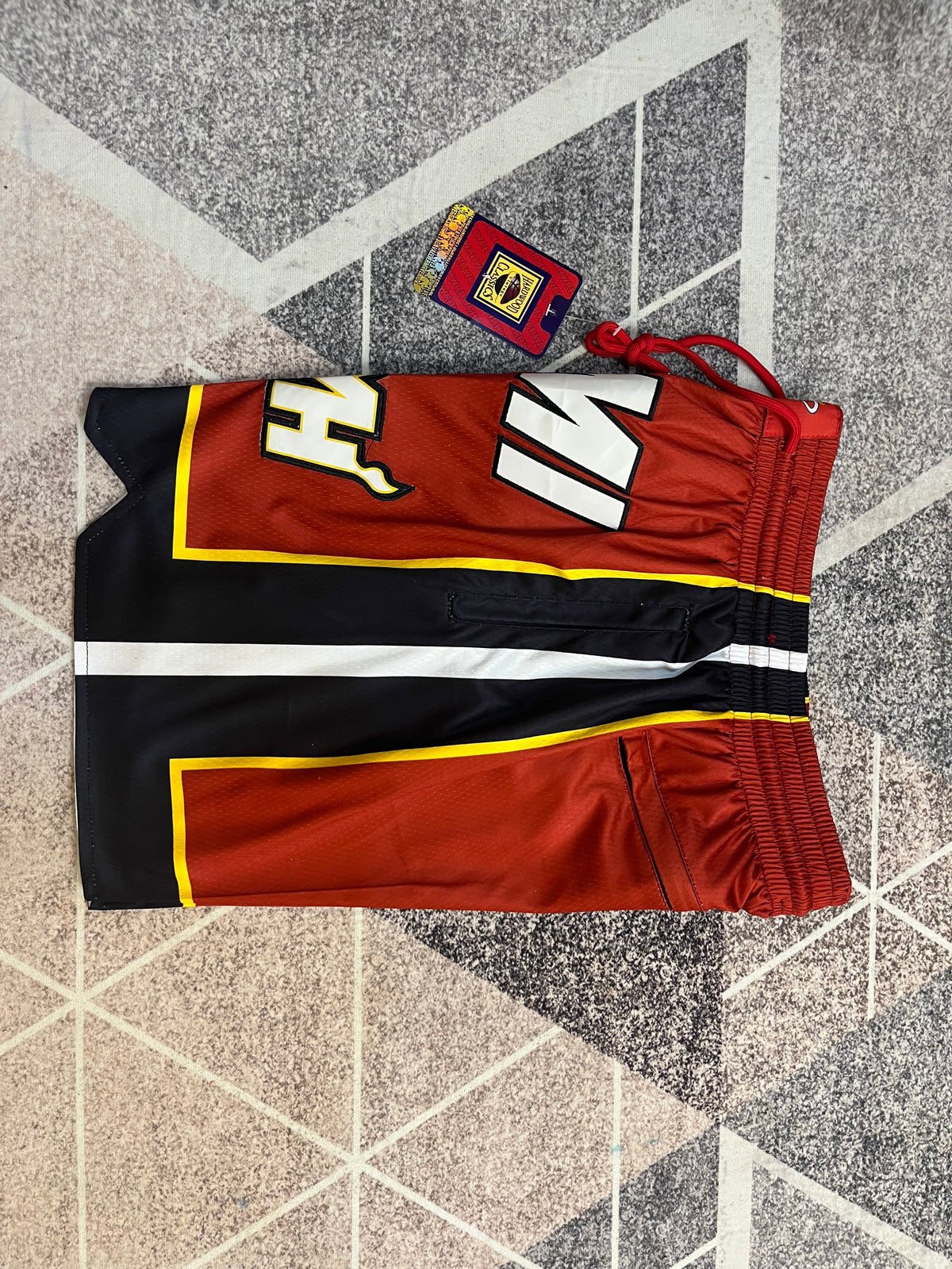 Maroon Miami Heat premium basketball shorts, side panel detail