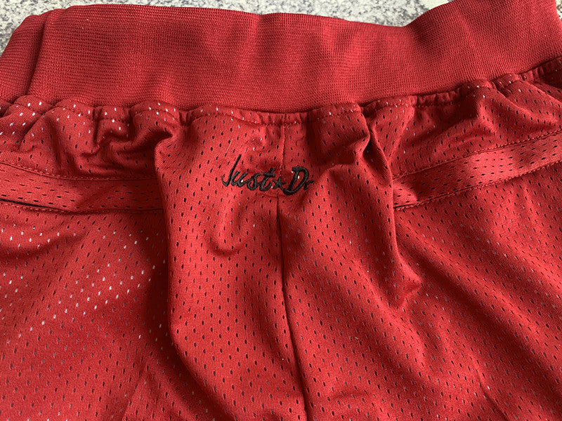 Red Miami Heat premium basketball shorts, waistband and label detail