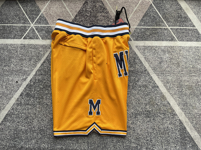 Yellow Michigan premium basketball shorts, side panel detail