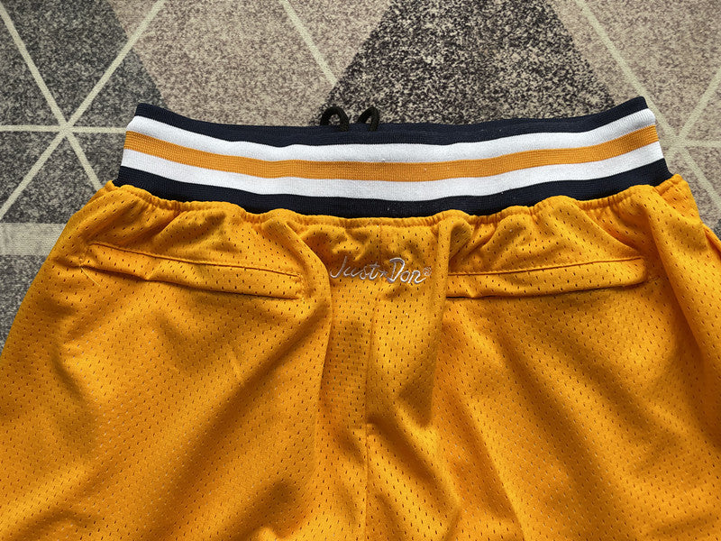 Yellow Michigan premium basketball shorts, waistband and label detail