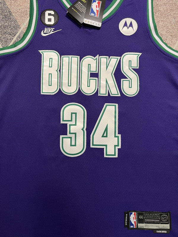 Purple Milwaukee Bucks basketball jersey, front graphic detail