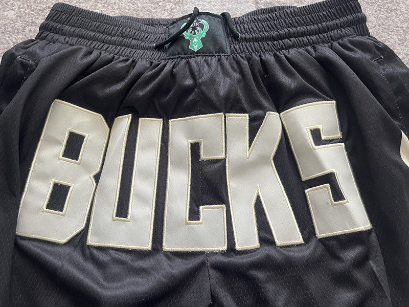 Black Milwaukee Bucks premium basketball shorts, waistband and label detail