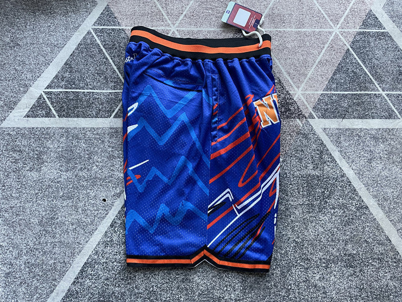 Blue New York Knicks premium basketball shorts, side panel detail