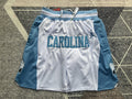 White North Carolina premium basketball shorts, full front view
