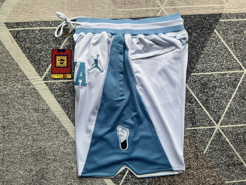 White North Carolina premium basketball shorts, side panel detail