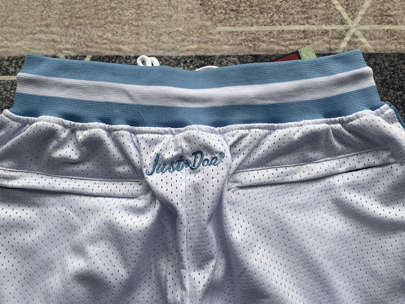 White North Carolina premium basketball shorts, waistband and label detail