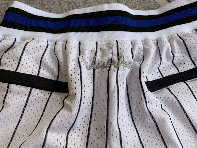 White Orlando Magic premium basketball shorts, waistband and label detail