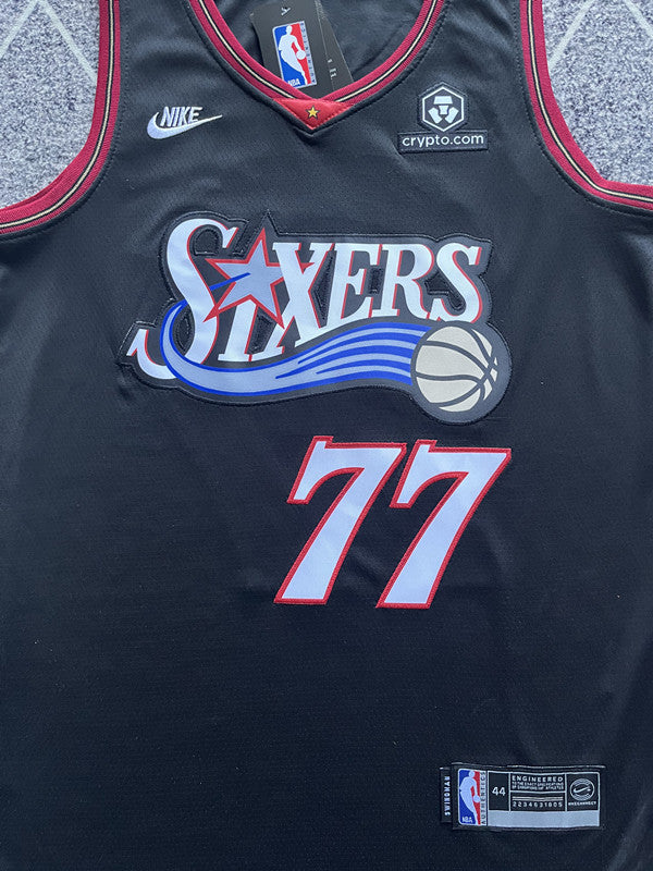 Black Philadelphia 76ers basketball jersey, front graphic detail