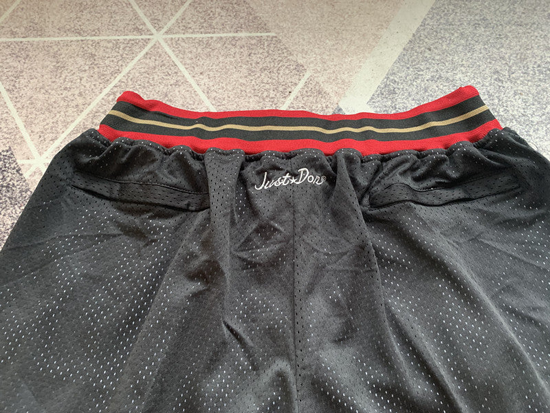 Black Philadelphia 76ers premium basketball shorts, waistband and label detail