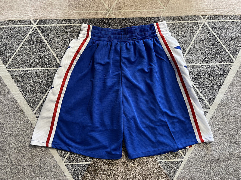 Blue Philadelphia 76ers basketball shorts, full back view