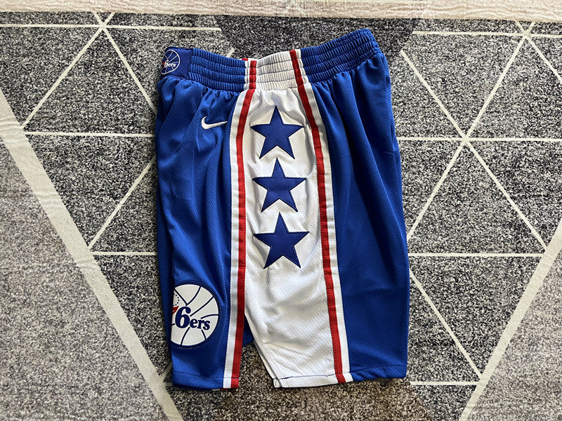 Blue Philadelphia 76ers basketball shorts, side panel detail