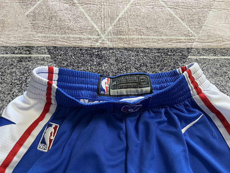 Blue Philadelphia 76ers basketball shorts, waistband and label detail