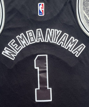 Black San Antonio Spurs basketball jersey, back lettering and number detail