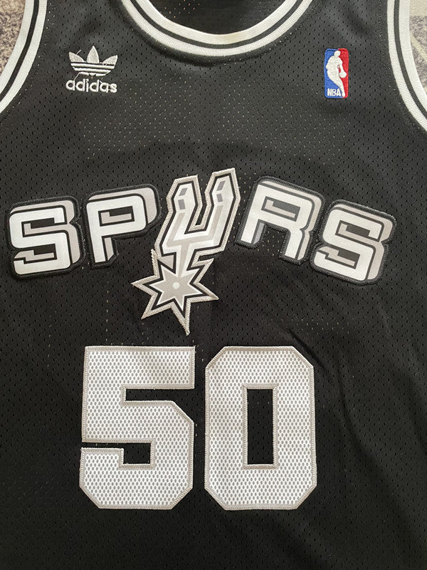 Black San Antonio Spurs basketball jersey, front graphic detail