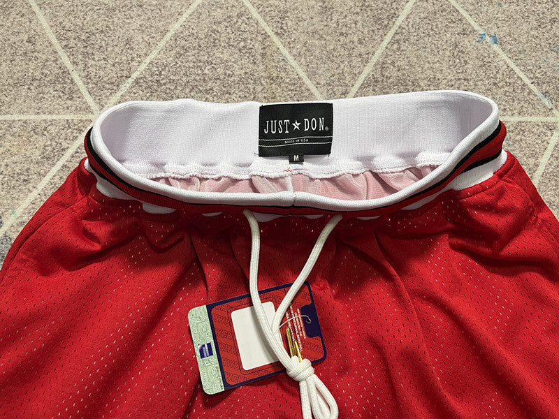 Red Slam Dunk premium basketball shorts, waistband and label detail