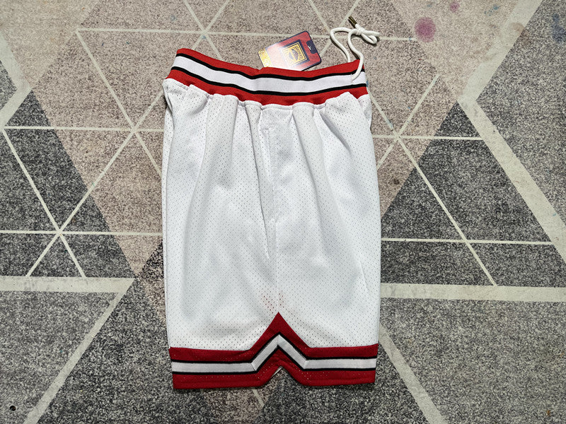 White Slam Dunk premium basketball shorts, side panel detail