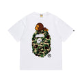 White graphic T-shirt, green camouflage ape-head graphic with a small brown cartoon character, front view