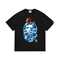 Black graphic T-shirt, blue camouflage ape-head graphic with a small brown cartoon character, front view