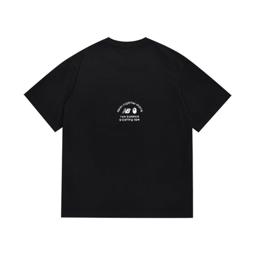 Black graphic T-shirt, small upper-back graphic, back view