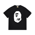 Black graphic T-shirt, large white ape-head graphic with nb lettering, front view