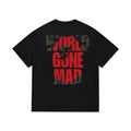 Black graphic T-shirt, large red and camouflage world gone mad lettering, back view