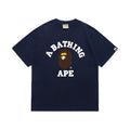 Navy graphic T-shirt, arched white lettering and brown and yellow ape-head graphic, front view
