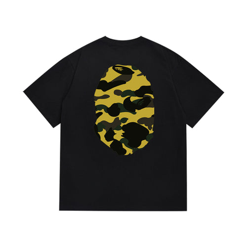 Black graphic T-shirt, large yellow and black camouflage ape-head graphics on front and back, back view