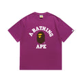 Purple graphic T-shirt, arched white lettering and brown and yellow ape-head graphic, front view