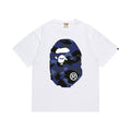 White graphic T-shirt, large blue camouflage ape-head graphics on front and back, front view