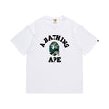 White graphic T-shirt, arched black lettering and green camouflage ape-head graphic, front view