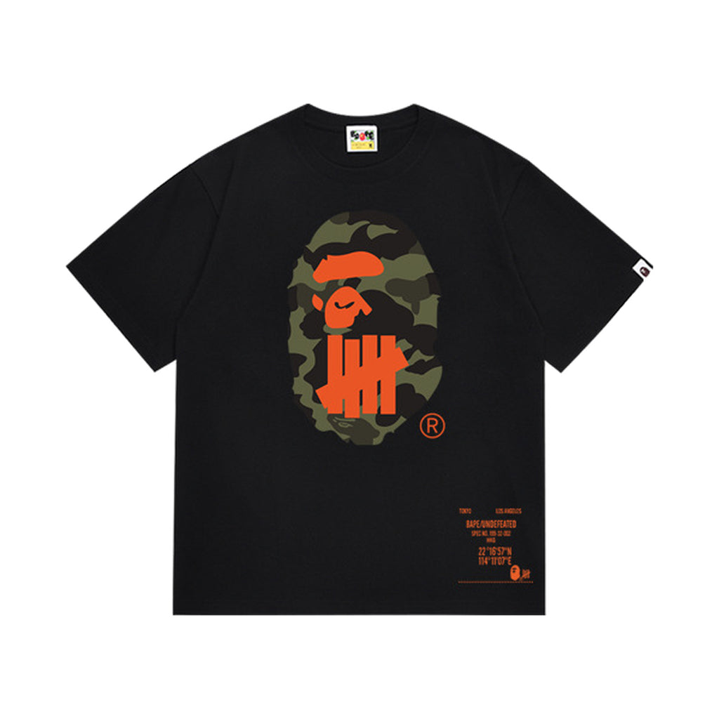 Black graphic T-shirt, olive camouflage ape-head graphic with orange tally-mark design and orange lettering on front and back, front view