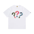 White graphic T-shirt, three multicolor camouflage question-mark graphics, front view
