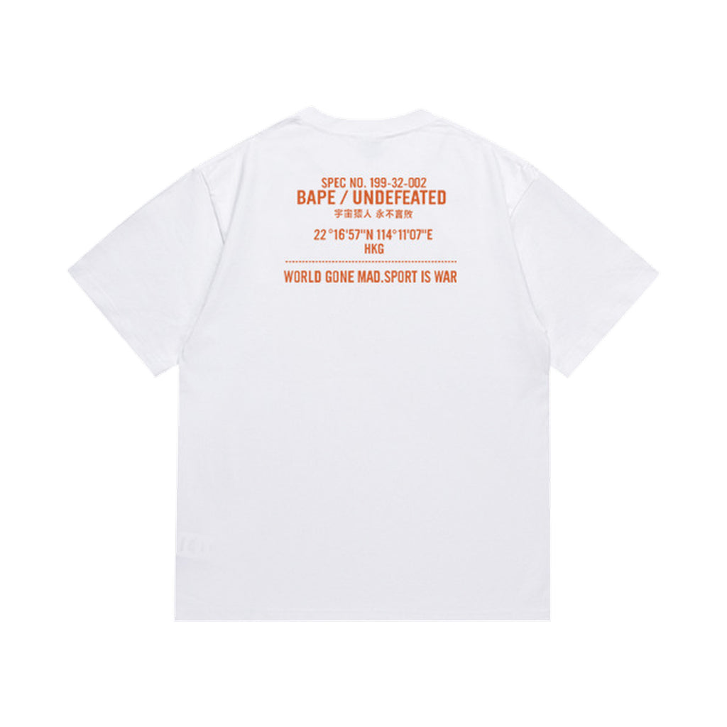White graphic T-shirt, orange upper-back lettering, back view