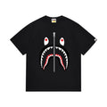 Black graphic T-shirt, large red, black and white shark-face graphic with a vertical zipper motif, front view