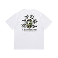 White graphic T-shirt, green camouflage ape graphic surrounded by lettering on back, back view