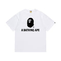 White graphic T-shirt, small black ape-head graphic above black lettering, front view