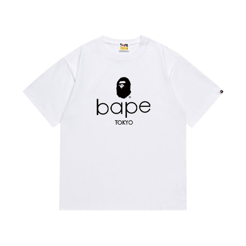 White graphic T-shirt, black ape-head graphic above lowercase lettering and tokyo text, front view