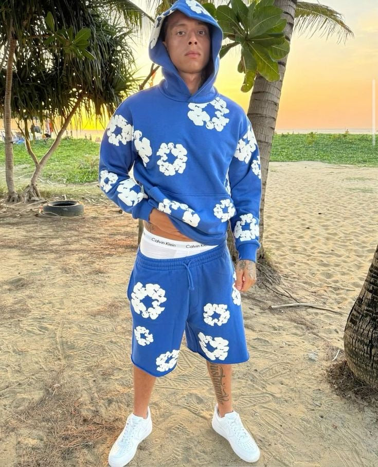 Blue floral shorts styled at the beach