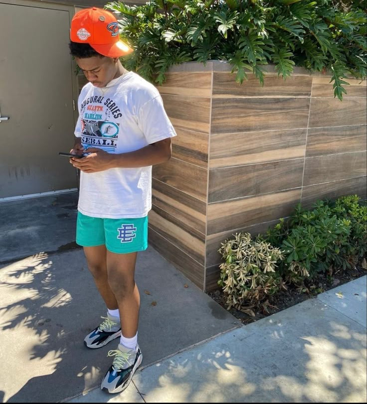Green graphic mesh shorts daytime outfit