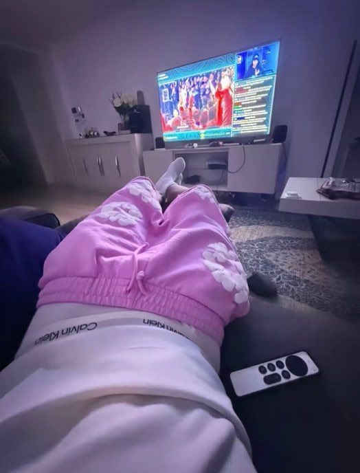 Pink floral shorts relaxed indoor point of view